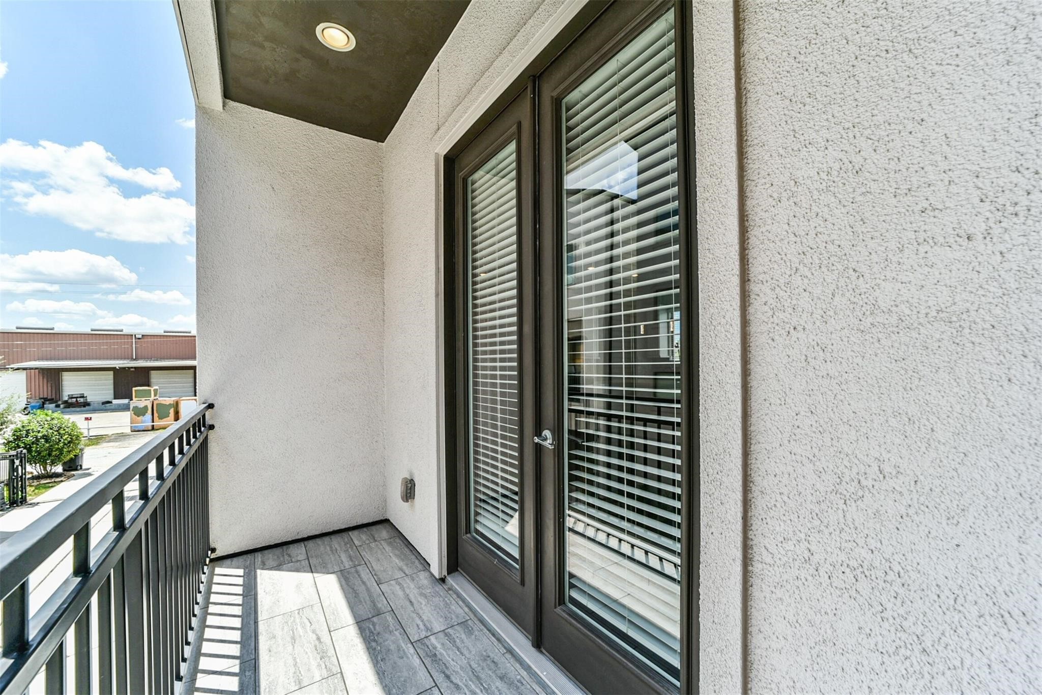 10806 Warwana Road, Unit C Houston, TX 77043 - Photo 2 of 9 a view of a balcony and an entryway