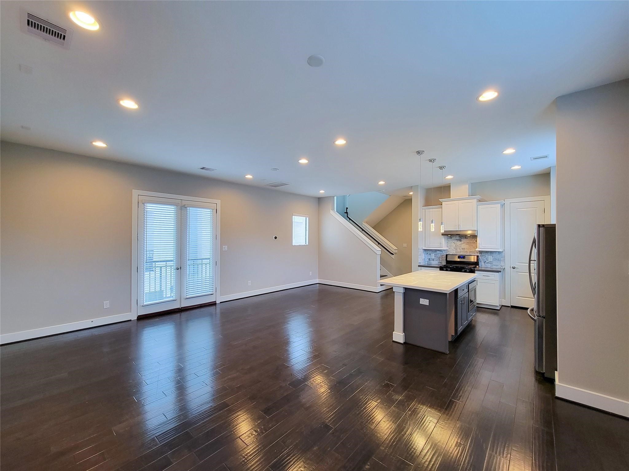 10806 Warwana Road, Unit C Houston, TX 77043 - Photo 4 of 9 a view of a kitchen with dining table and chairs