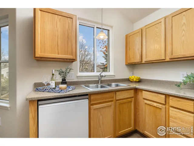 a kitchen with sink and cabinets