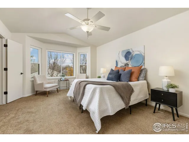 a bed room with a bed and a window