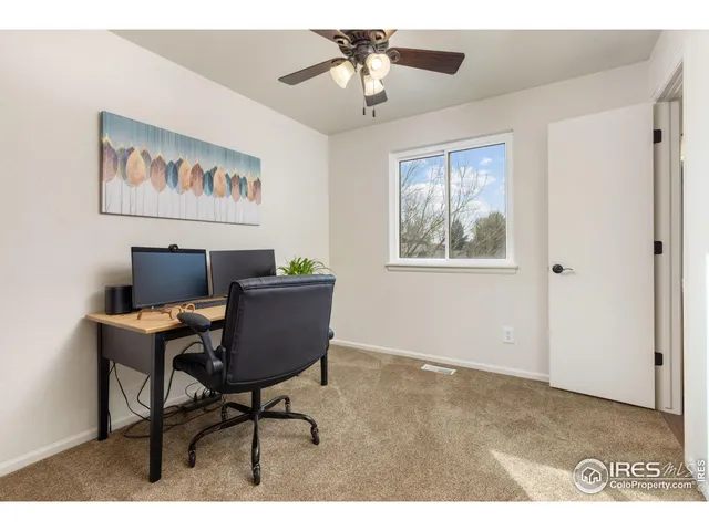 a workspace with furniture and window