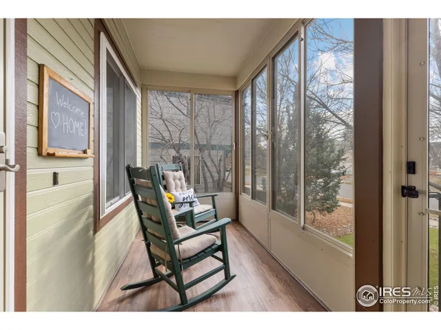 a balcony with table and chairs