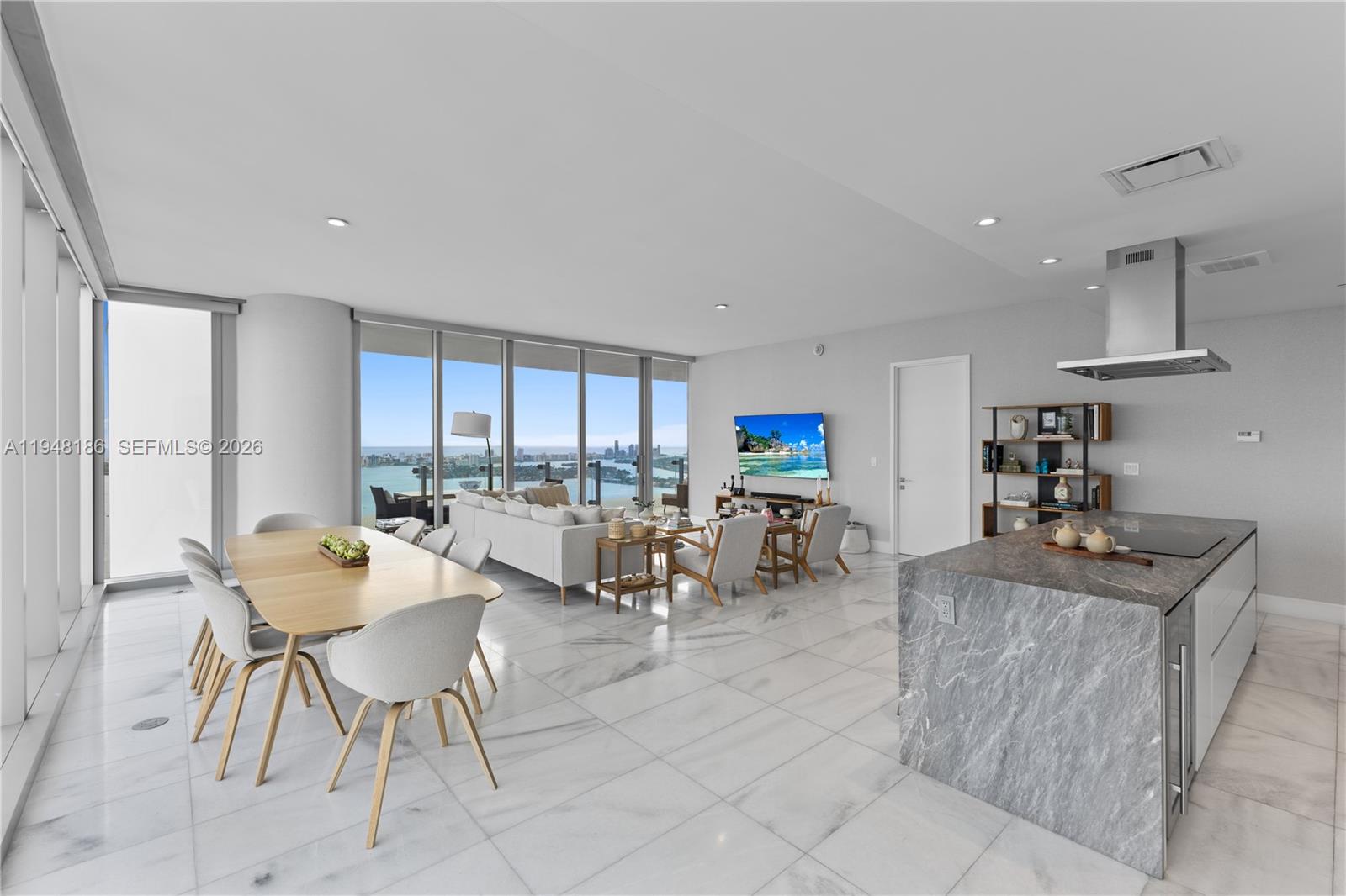 700 Northeast 26th Terrace, Unit 4701 Miami, FL 33137 - Photo 11 of 33 a living room with furniture and a large window