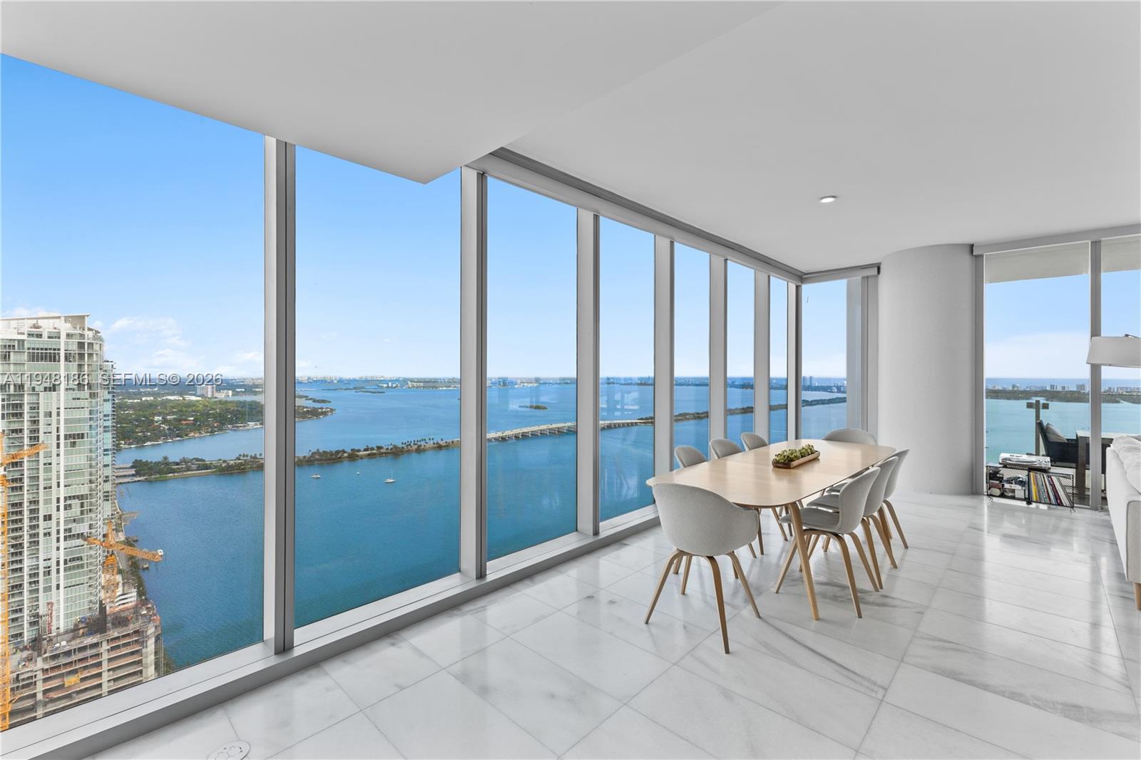 700 Northeast 26th Terrace, Unit 4701 Miami, FL 33137 - Photo 12 of 33 a view of a room with a table and chairs