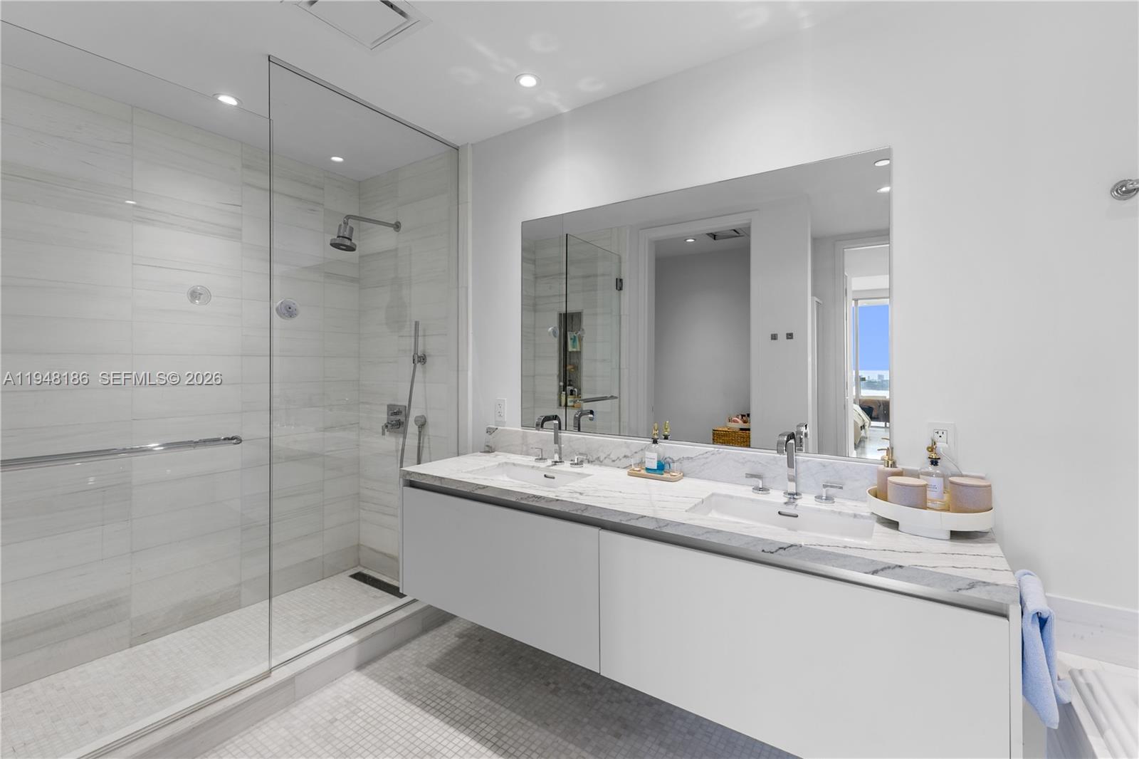 700 Northeast 26th Terrace, Unit 4701 Miami, FL 33137 - Photo 20 of 33 a bathroom with a granite countertop sink mirror and double