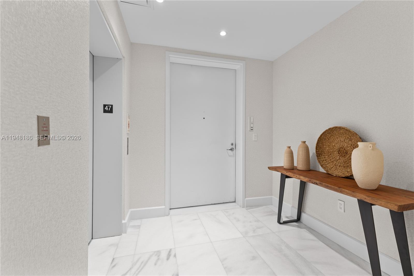 700 Northeast 26th Terrace, Unit 4701 Miami, FL 33137 - Photo 29 of 33 a view of a room with a table and a chair