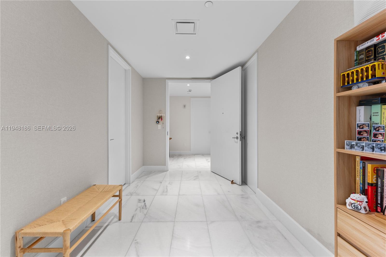 700 Northeast 26th Terrace, Unit 4701 Miami, FL 33137 - Photo 31 of 33 a view of a hallway to a livingroom with furniture