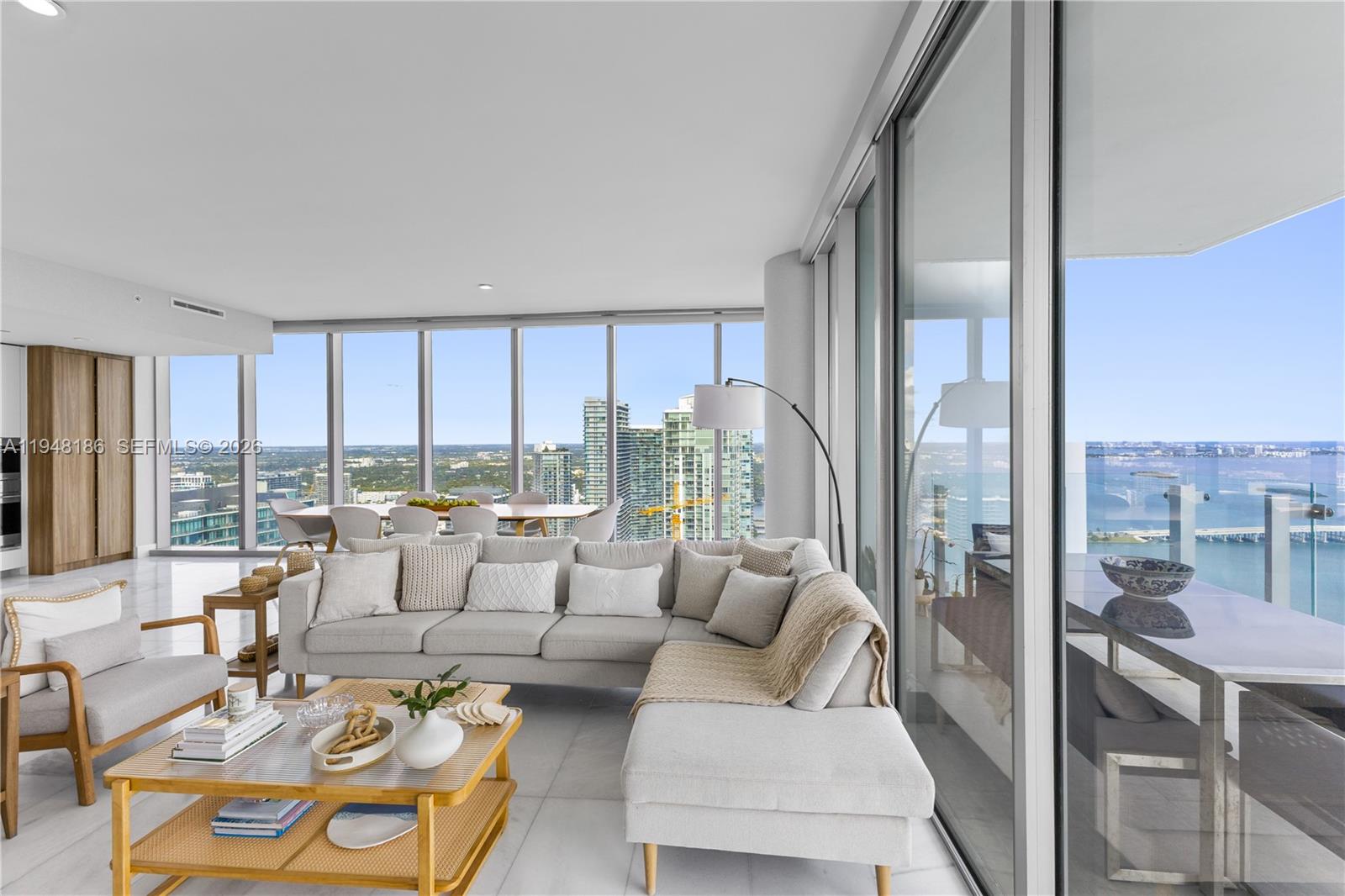 700 Northeast 26th Terrace, Unit 4701 Miami, FL 33137 - Photo 6 of 33 a living room with furniture and a large window