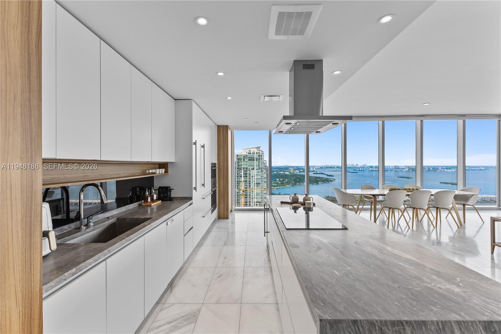 700 Northeast 26th Terrace, Unit 4701 Miami, FL 33137 - Photo 9 of 33 a living room with furniture and floor to ceiling windows