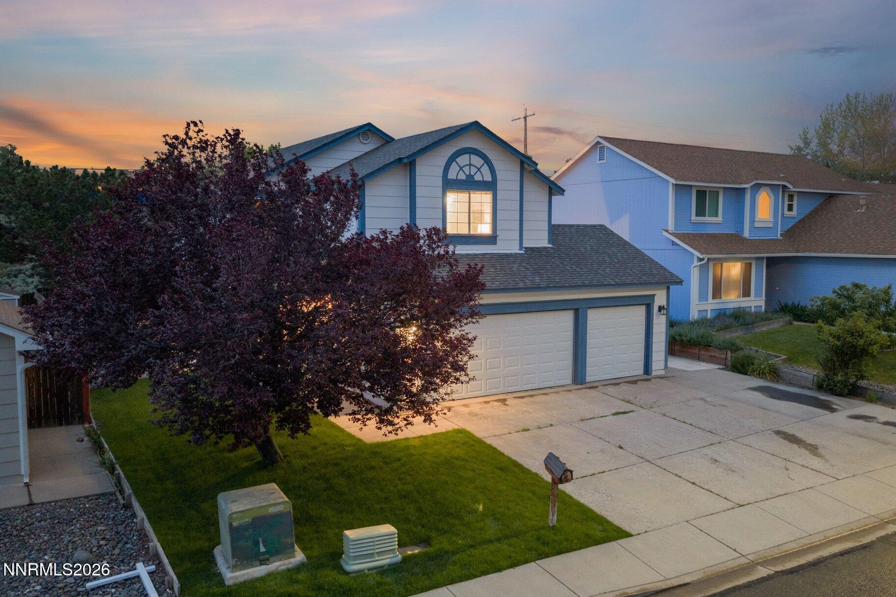 8486 Piper Place Reno, NV 89506 - Photo 79 of 80 a front view of a house with garden