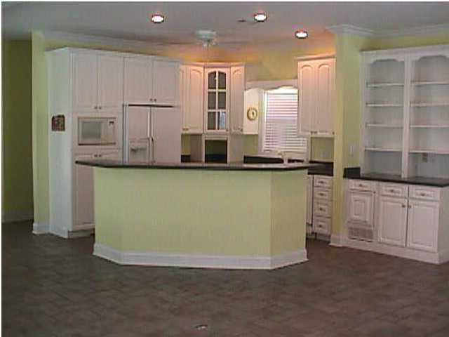 132 Emerald Ridge Santa Rosa Beach, FL 32459 - Photo 4 of 6 a view of a kitchen with stainless steel appliances granite countertop a stove and a sink