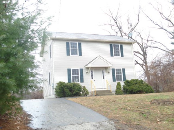 50 Woodruff Street Springfield, MA 01109 - Photo 1 of 12 a front view of a house with a yard and garage