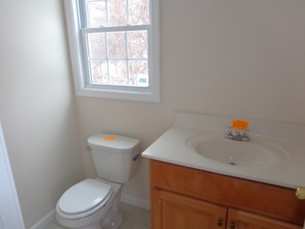 50 Woodruff Street Springfield, MA 01109 - Photo 3 of 12 a white toilet sitting next to a bathroom sink