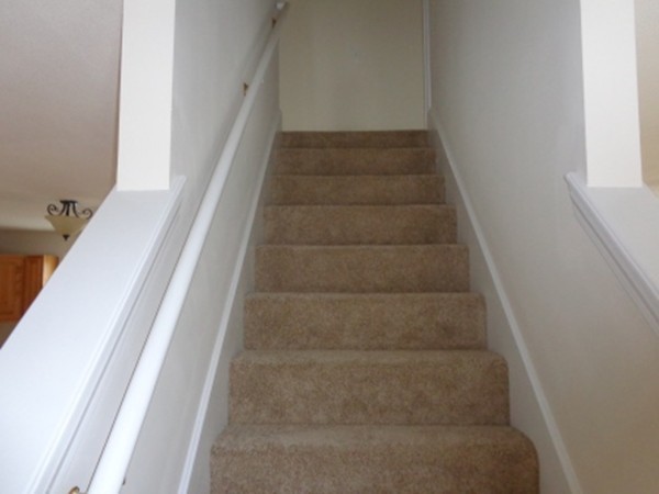 50 Woodruff Street Springfield, MA 01109 - Photo 7 of 12 a view of staircase with white walls and white door