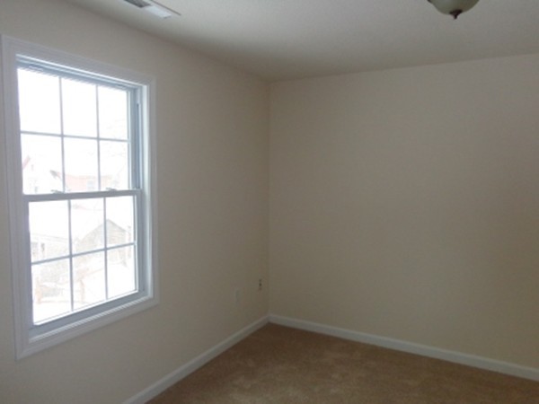 50 Woodruff Street Springfield, MA 01109 - Photo 8 of 12 an empty room with a window