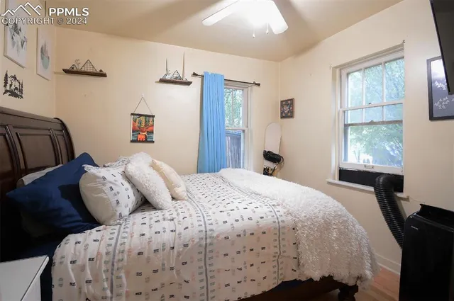 a view of a livingroom with furniture and a window