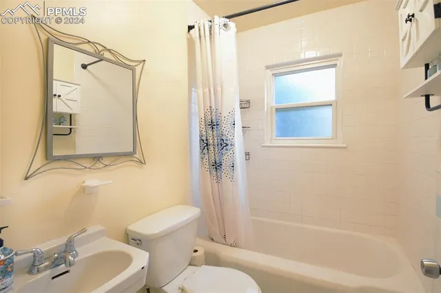 a view of a kitchen with wooden floor