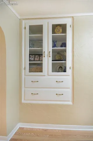 a kitchen with granite countertop a stove and a sink