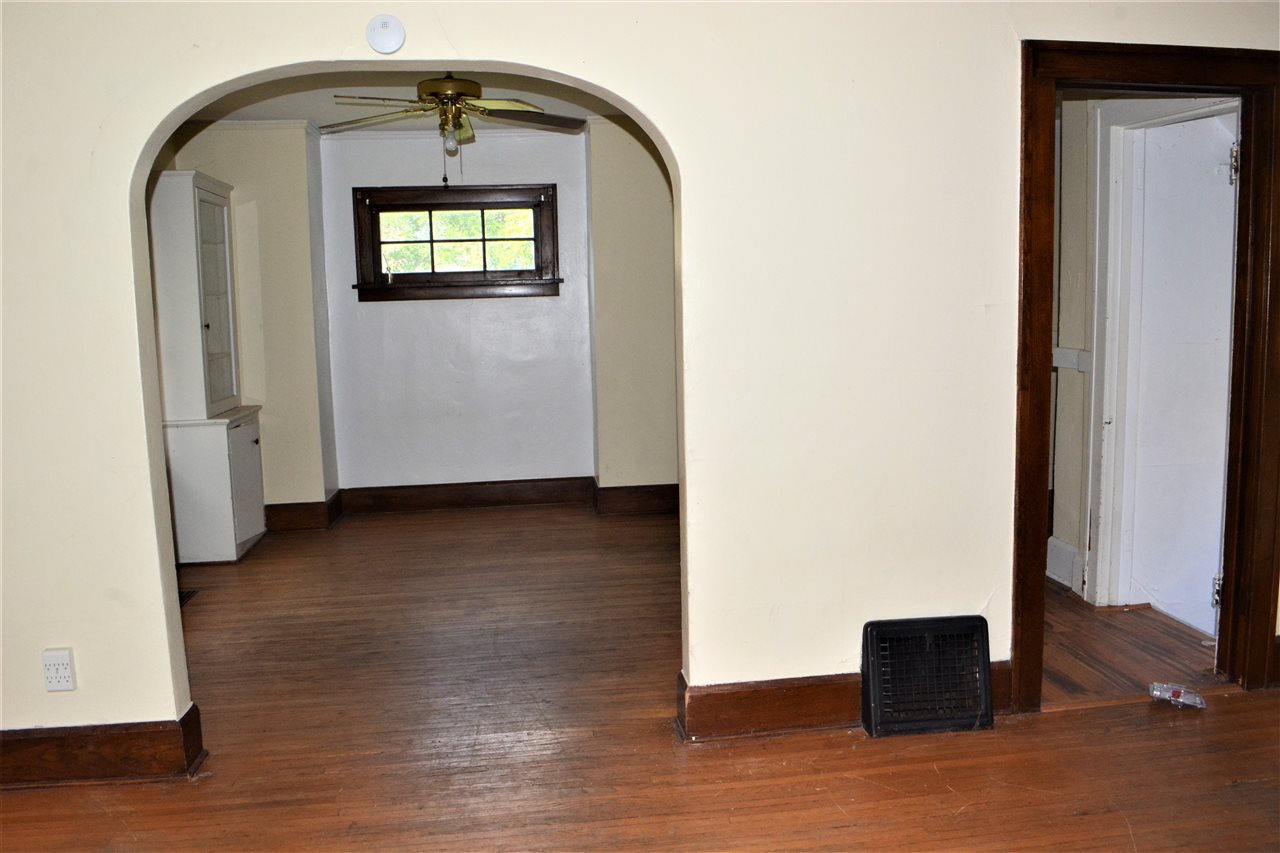 1806 Ridge Avenue Rockford, IL 61103 - Photo 5 of 18 an empty room with wooden floor and windows