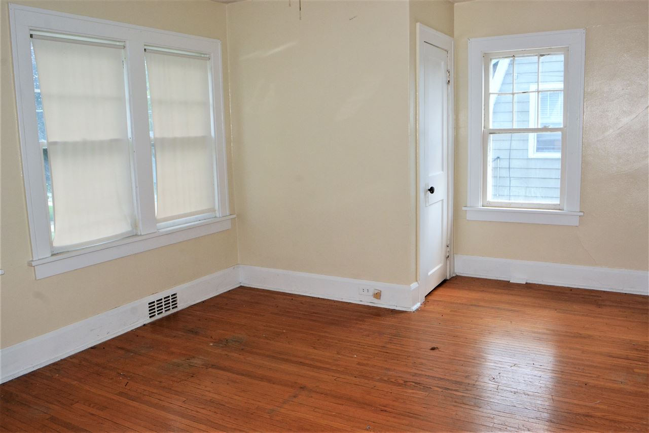 1806 Ridge Avenue Rockford, IL 61103 - Photo 10 of 18 an empty room with wooden floor and windows