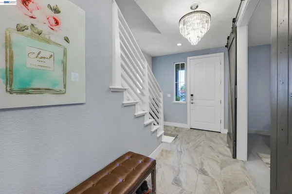 a utility room with sink dryer and washer
