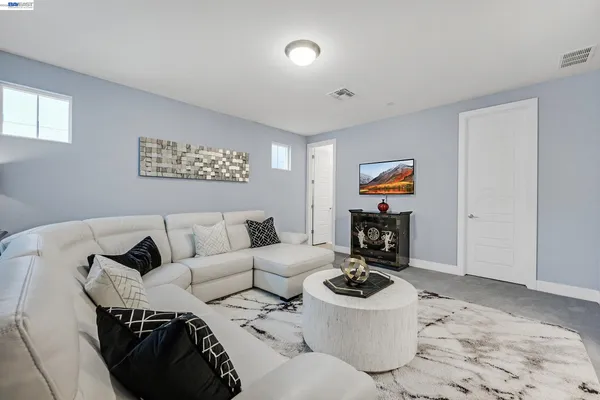 a living room with furniture and a window