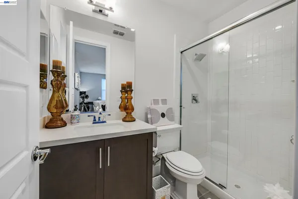 a front view of a residential apartment building with a yard