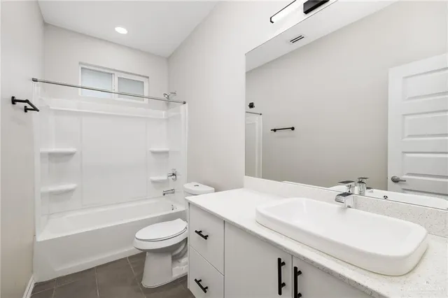 a bathroom with a sink a toilet and a bathtub