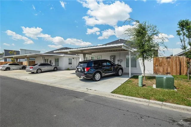 a view of a car parked in front of a house