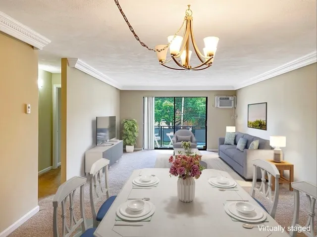 a living room with furniture a table and chairs