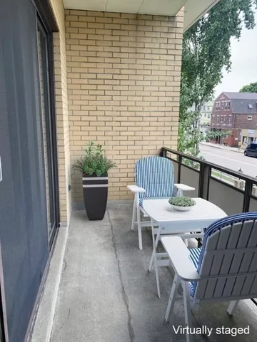 a view of a patio with a table and chairs