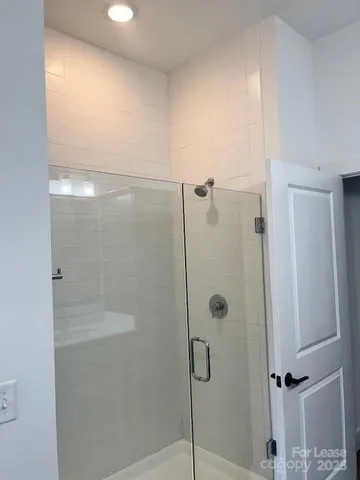 a bathroom with a double vanity sink toilet and a mirror