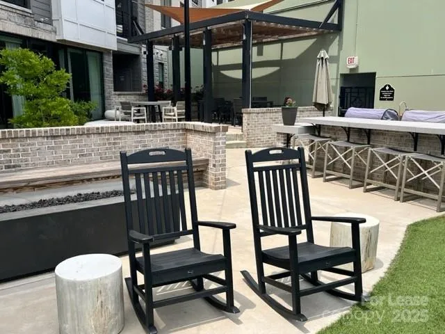 a view of a chairs and table in the patio