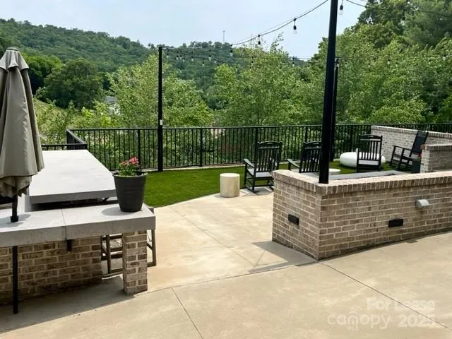 a view of a couches with wooden floor