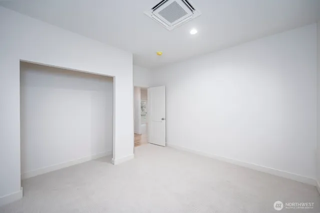 a bathroom with a granite countertop toilet a sink and a bathtub