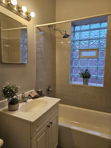 a bathroom with a sink and a bathtub