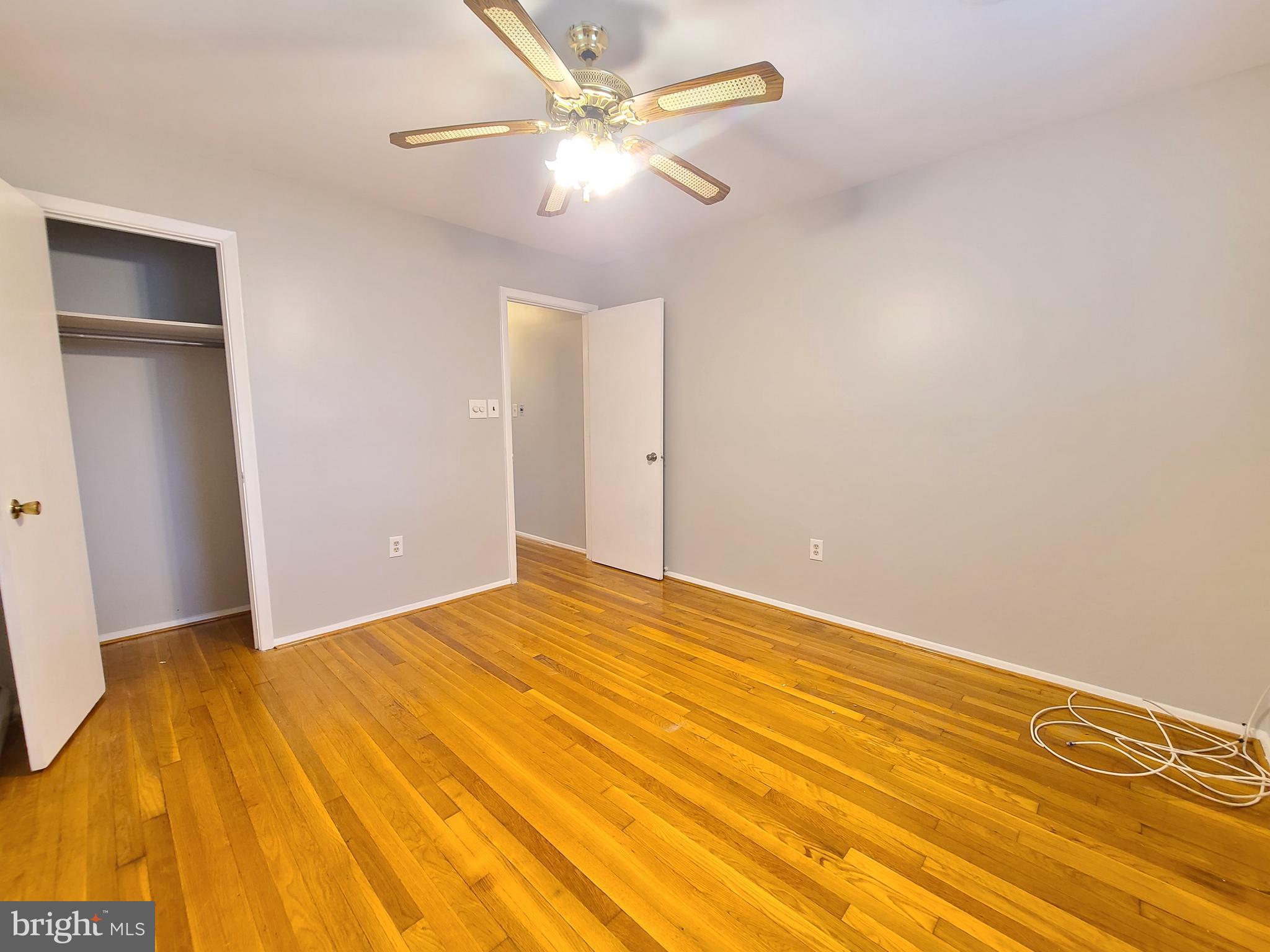 1524 Florida Avenue Woodbridge, VA 22191 - Photo 15 of 36 a view of a big room with wooden floor and a ceiling fan