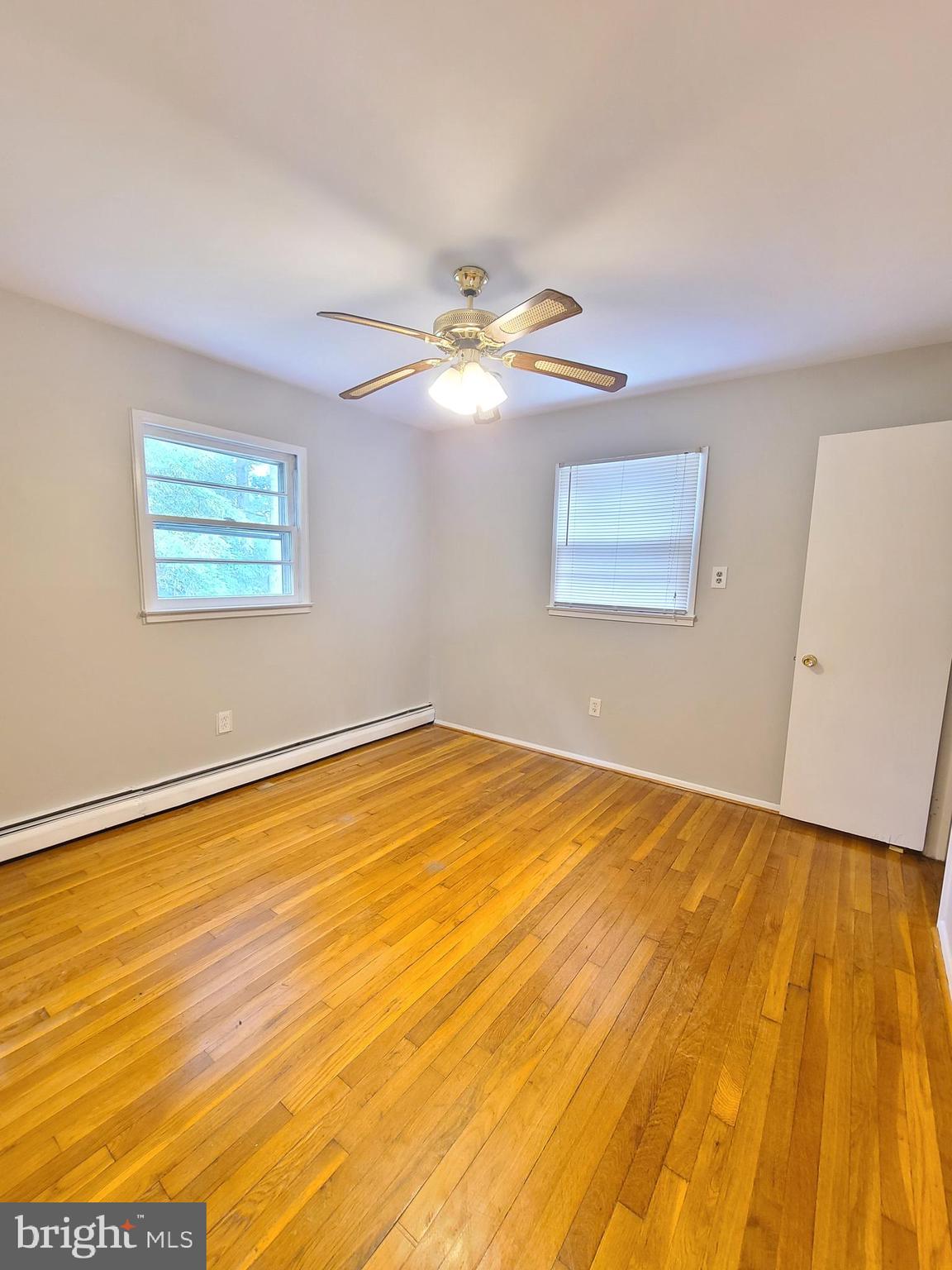 1524 Florida Avenue Woodbridge, VA 22191 - Photo 16 of 36 a view of a room with a wooden floor and a ceiling fan