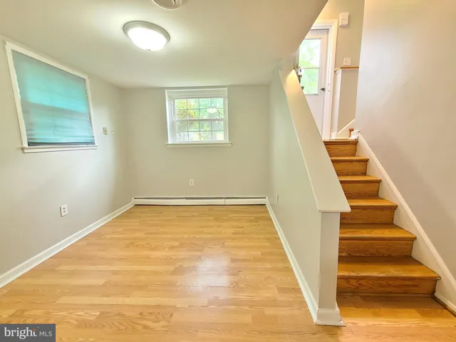 a view of an entryway with wooden floor