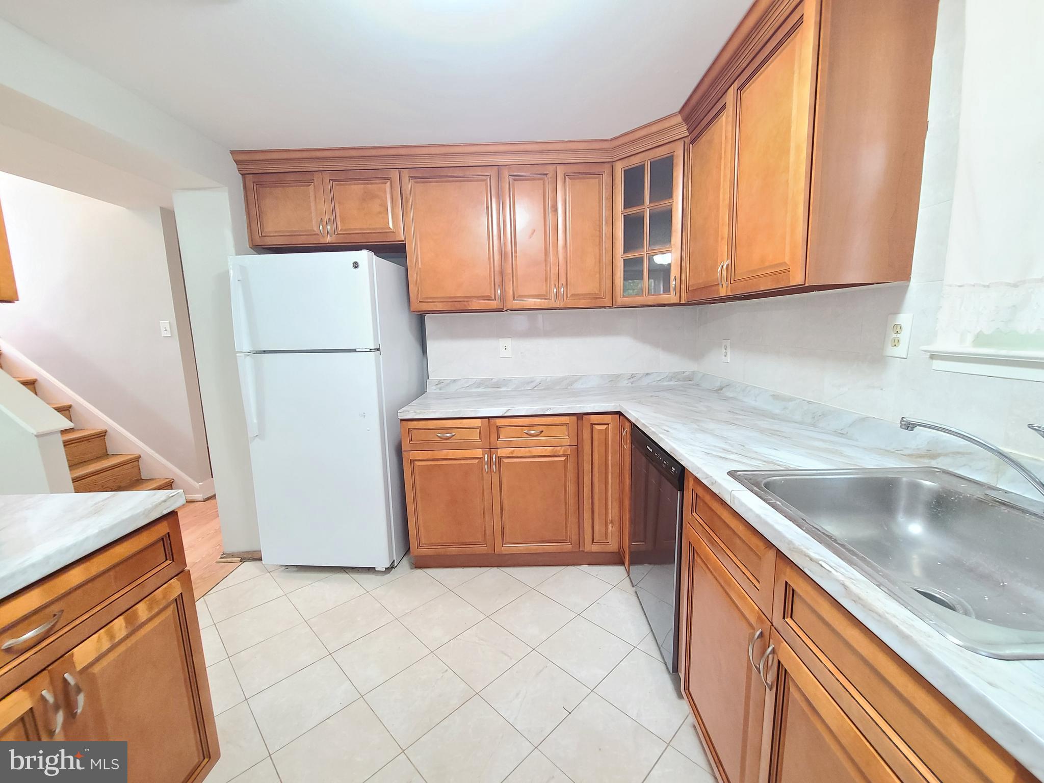 1524 Florida Avenue Woodbridge, VA 22191 - Photo 28 of 36 a kitchen with a refrigerator sink and cabinets