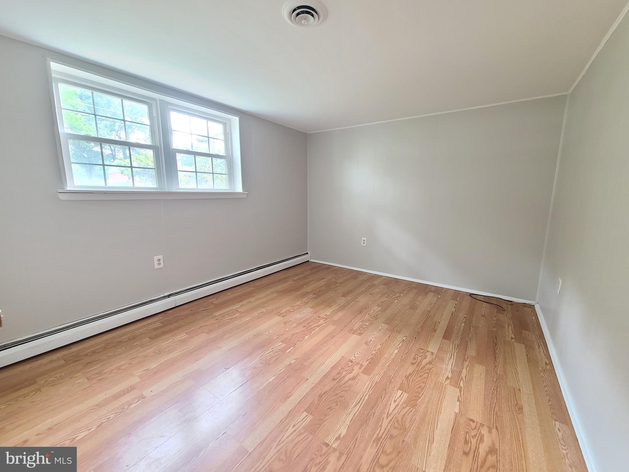 1524 Florida Avenue Woodbridge, VA 22191 - Photo 32 of 36 a view of an empty room with wooden floor and a window