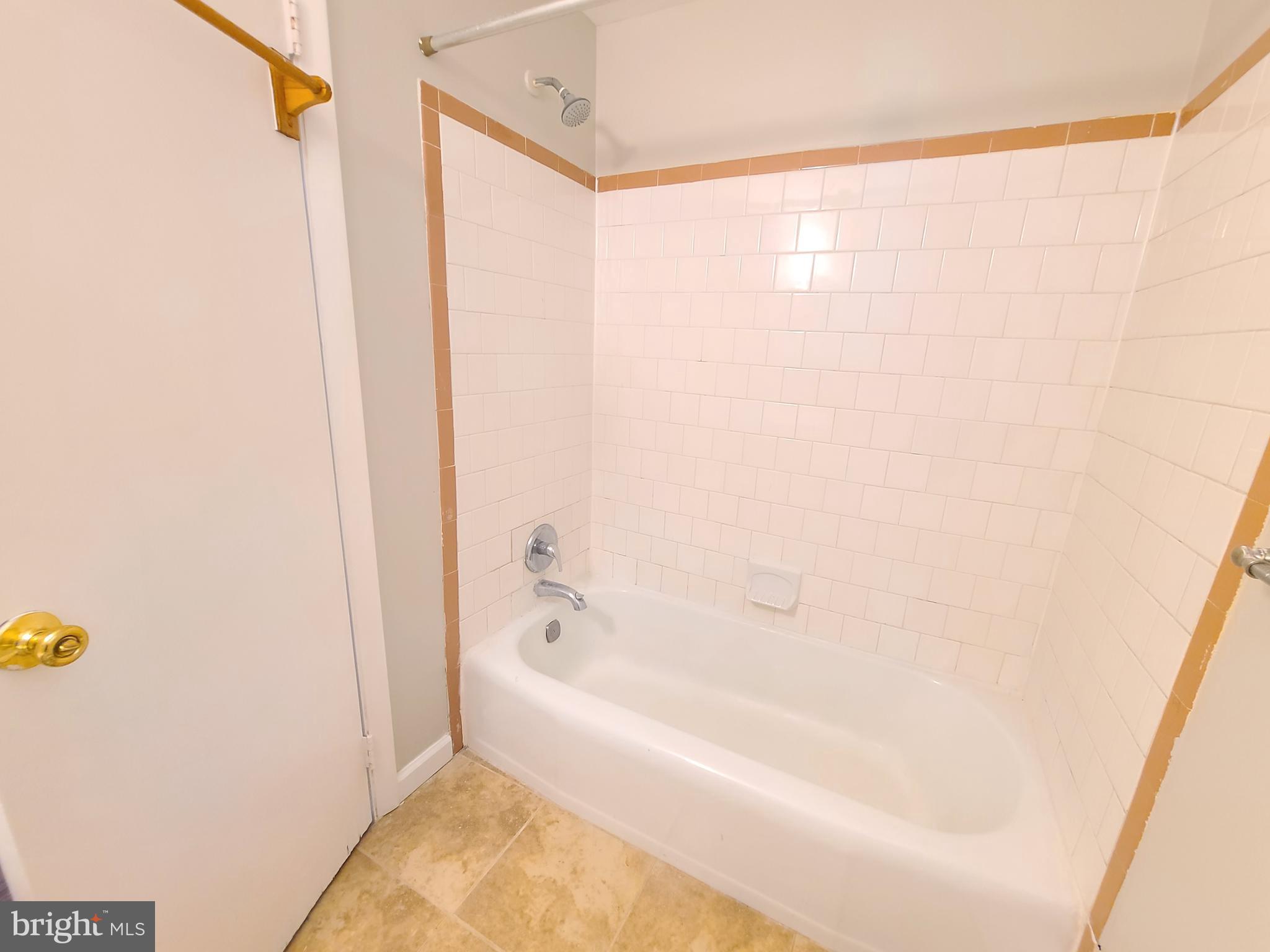 1524 Florida Avenue Woodbridge, VA 22191 - Photo 34 of 36 a white bath tub sitting next to a shower