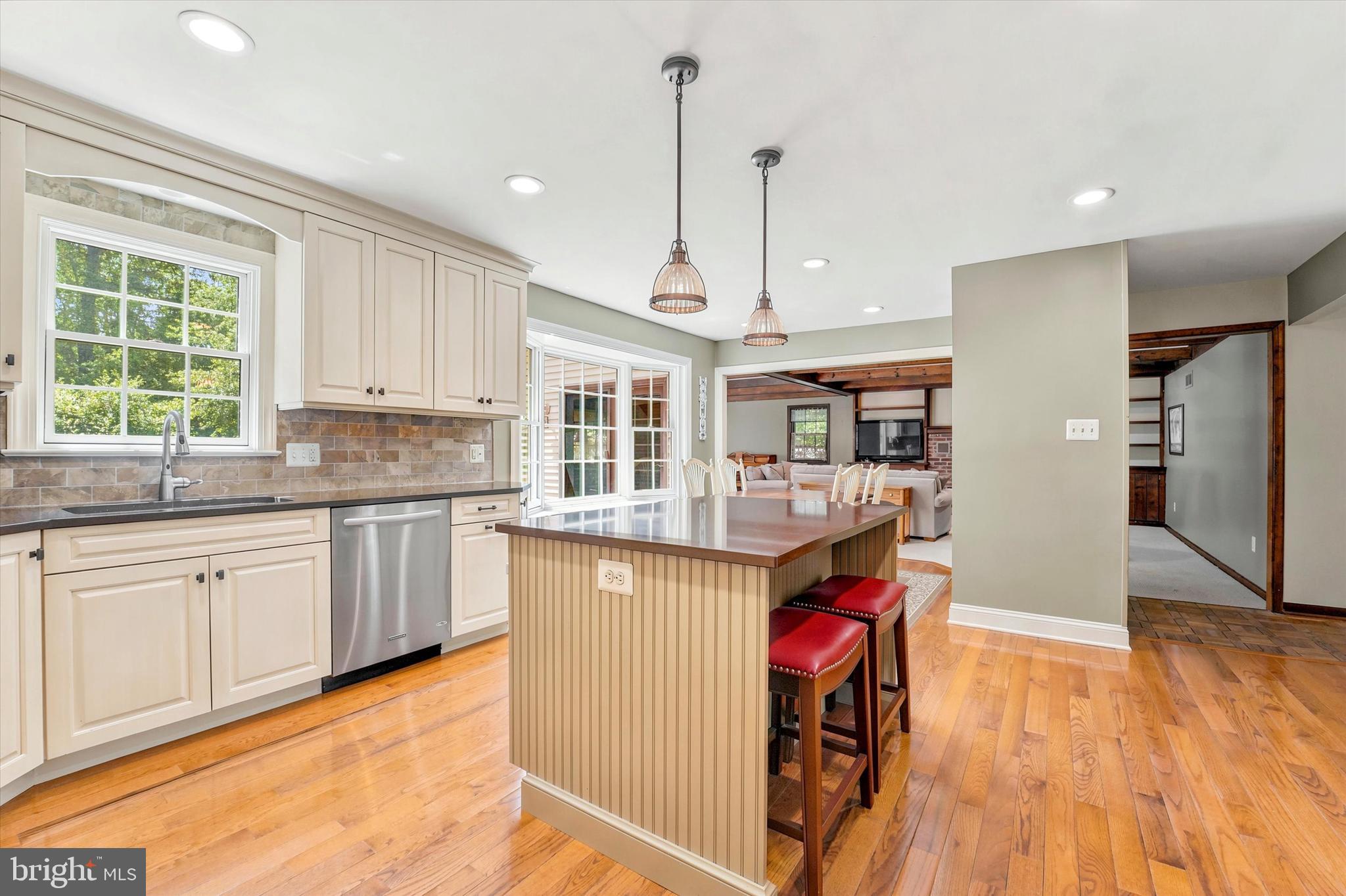 1980 Terwood Road Huntingdon Valley, PA 19006 - Photo 4 of 48 a kitchen with stainless steel appliances granite countertop a refrigerator a sink dishwasher a stove and white countertops with wooden floor