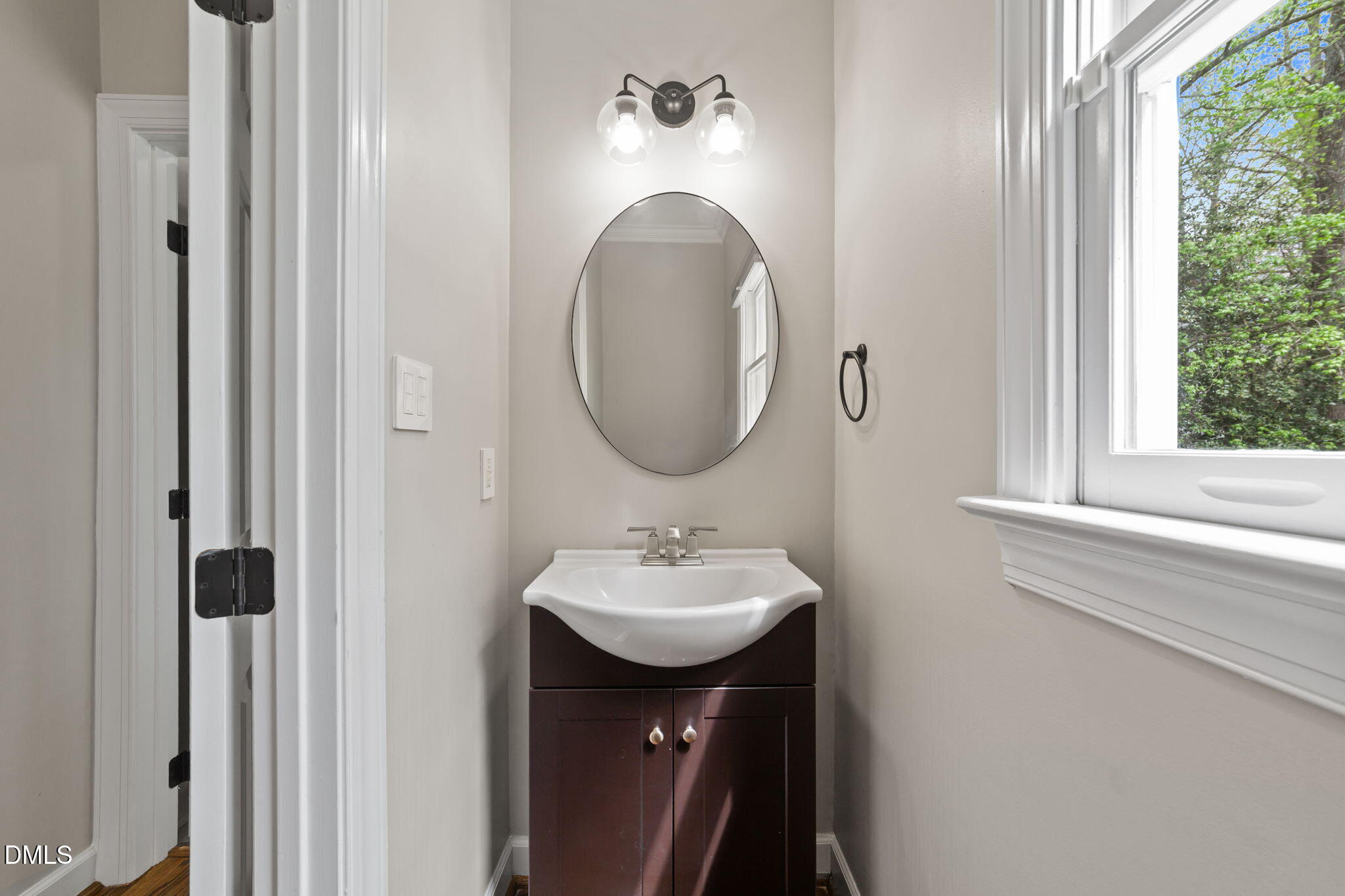 2004 Sassacus Lane Apex, NC 27523 - Photo 16 of 37 a bathroom with a sink and a mirror