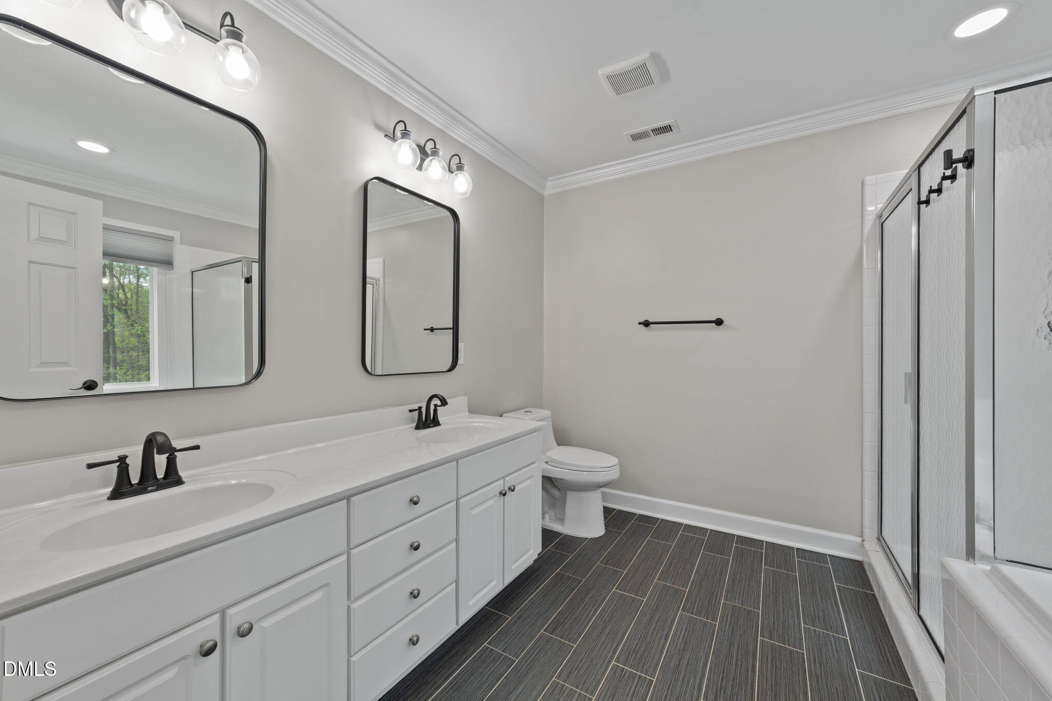 2004 Sassacus Lane Apex, NC 27523 - Photo 22 of 37 a spacious bathroom with a double vanity sink mirror and toilet