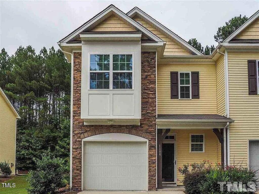 1106 Nicklaus Drive Durham, NC 27705 - Photo 1 of 7 a front view of a house with a yard