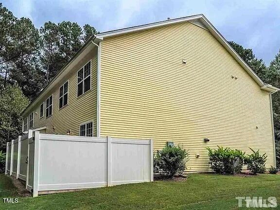 1106 Nicklaus Drive Durham, NC 27705 - Photo 7 of 7 a view of a house with a yard and plants