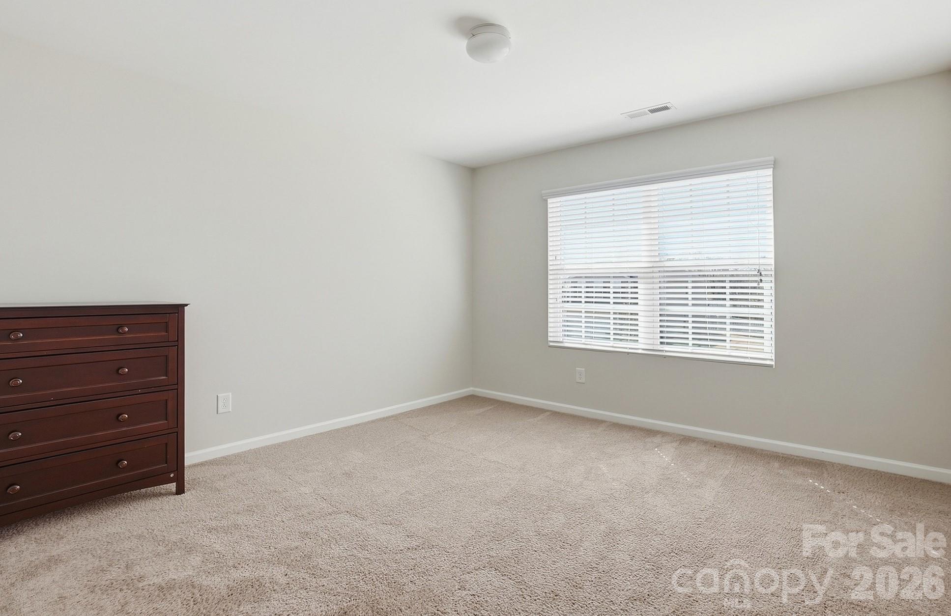2009 Houndscroft Road Indian Trail, NC 28079 - Photo 14 of 25 a view of room with a ceiling fan and a window