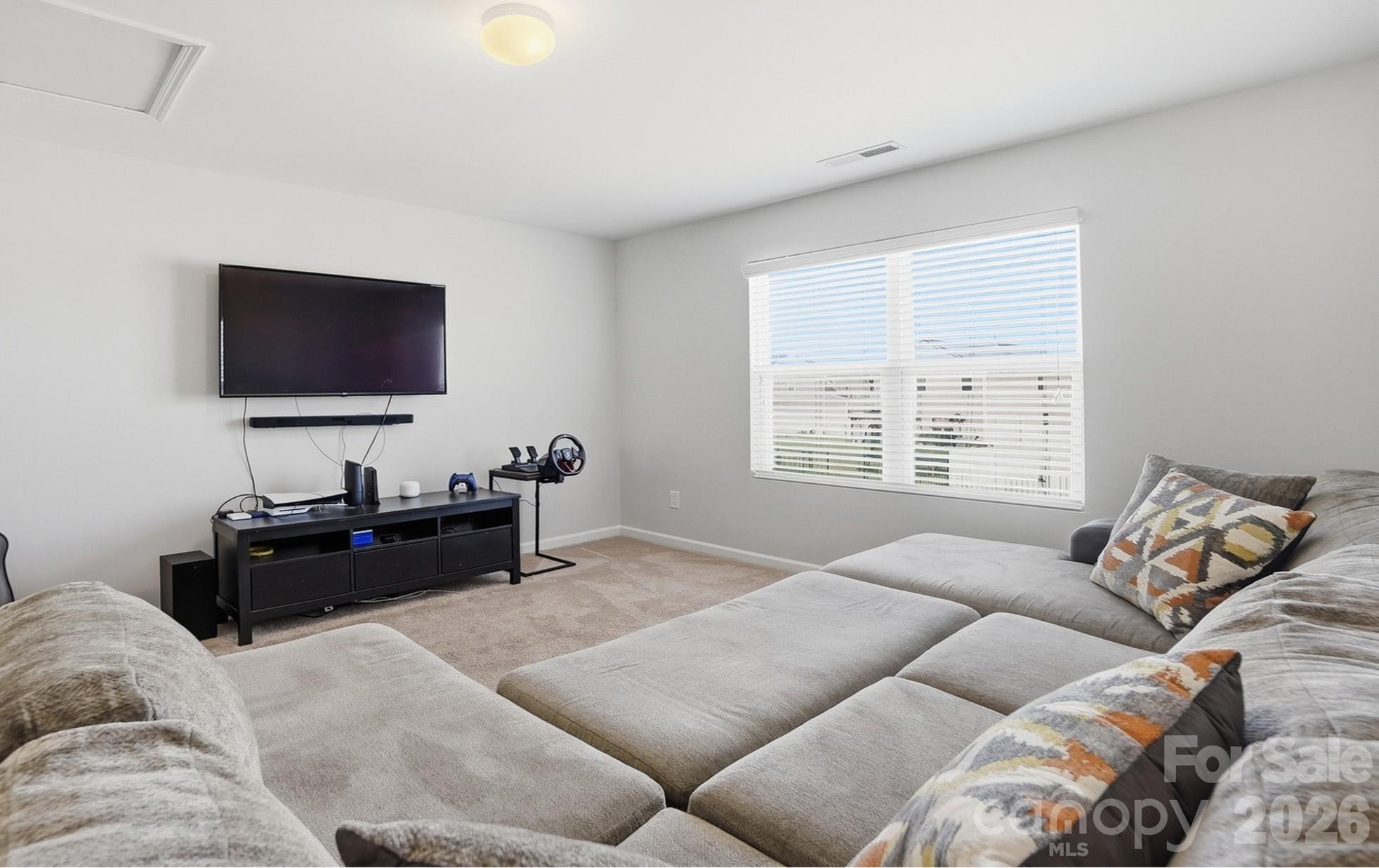 2009 Houndscroft Road Indian Trail, NC 28079 - Photo 15 of 25 a living room with furniture and a flat screen tv