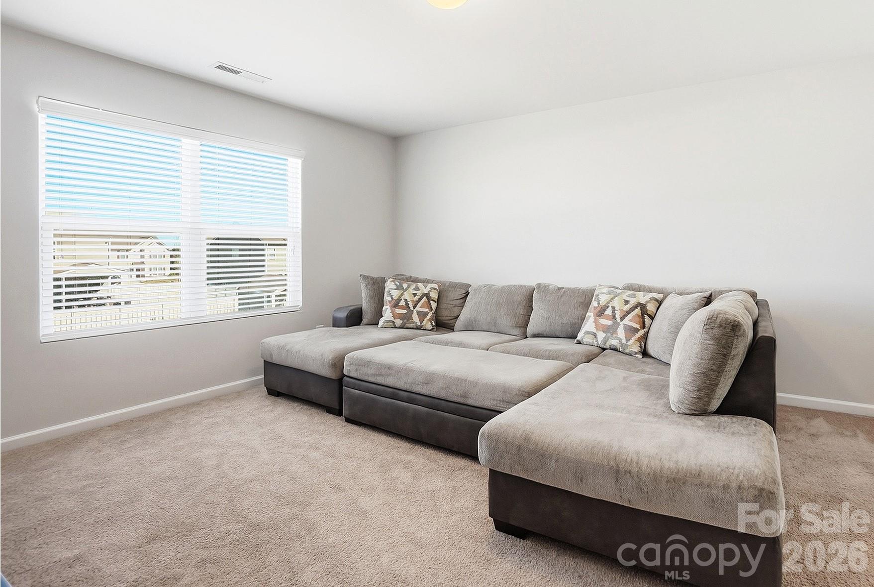 2009 Houndscroft Road Indian Trail, NC 28079 - Photo 16 of 25 a living room with a couch and a window